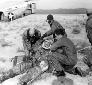 The ground crew assists Capt. Kittinger in removing his flight gear after the successful flight of Excelsior III. (U.S. Air Force photo)